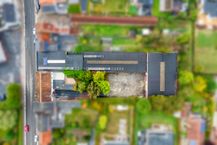 Magazijn van circa 1.285 m² met woning te koop in Bellegem