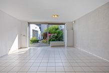 Instapklaar gelijkvloers appartement met gemeenschappelijke tuin en fietsenberging in hartje Kapellen!