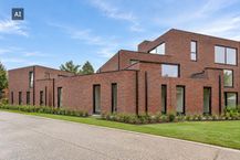 New construction project in Genk with 3 houses and 5 apartments