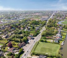 Ontwikkelingsgrond met verhuurd tankstation te koop Deinze