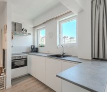 Appartement magnifiquement rénové avec terrasse et 2 chambres
