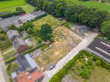 Industrieel projectgrond te koop in Ingooigem. 