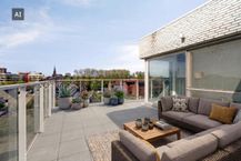 Recent dakappartement te koop in Boom met zicht op het water